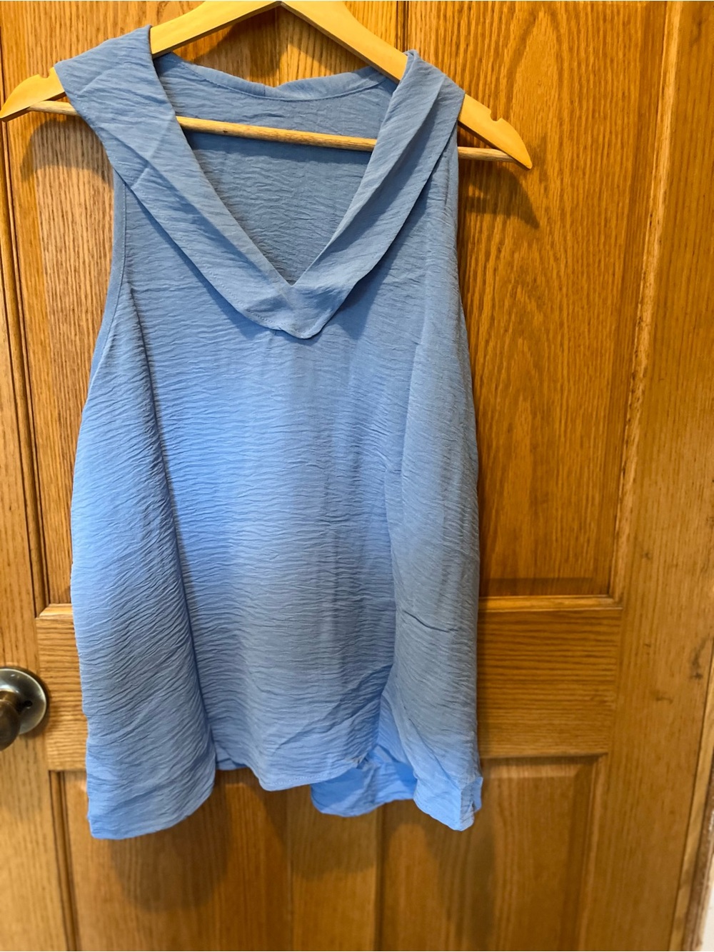Sleeveless Blue V-Neck Women's Top and pants.
